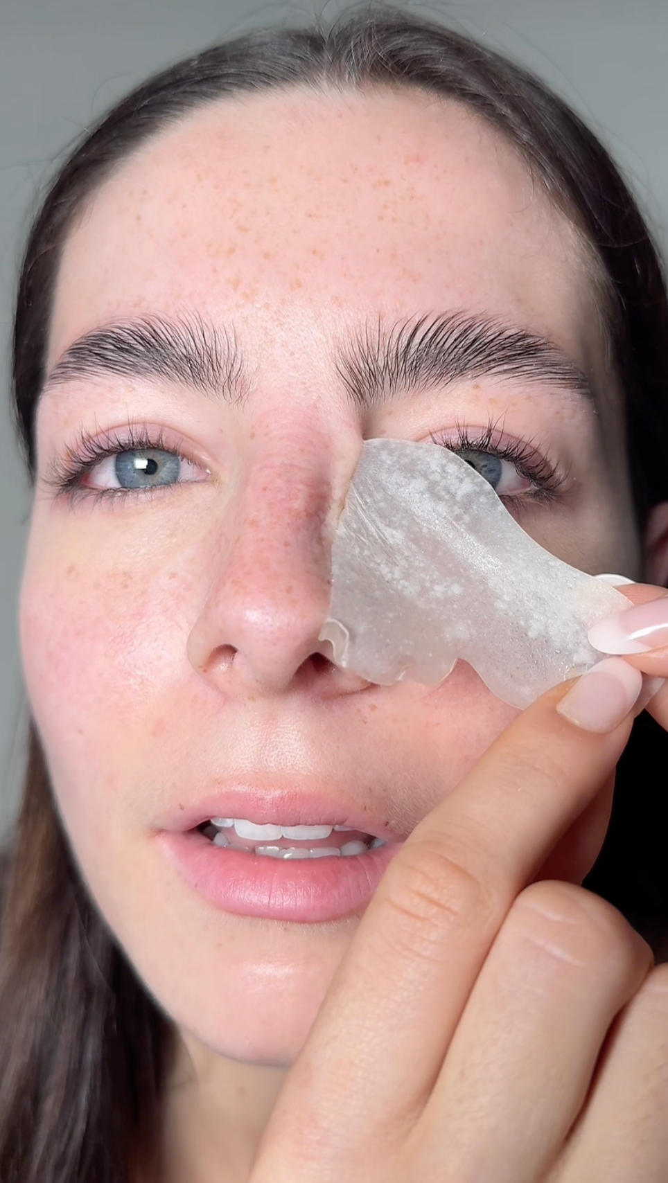 A girl revealing clearer skin after a nose patch
