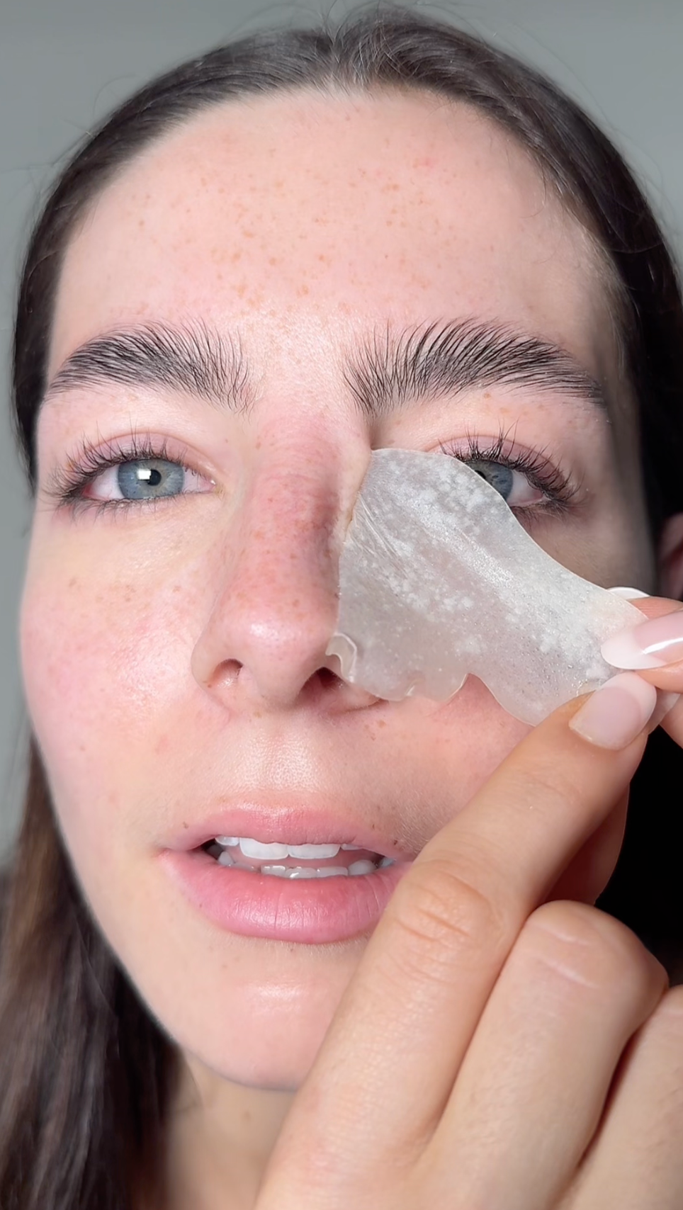 A girl revealing clearer skin after a nose patch 